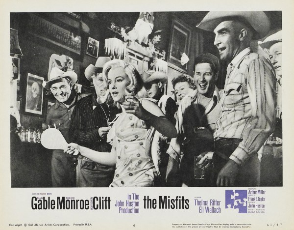 Marilyn Monroe shows the boys who's boss at paddleball in a lobby card for John Huston's THE MISFITS (1961). Courtesy of Jerry Murbach.