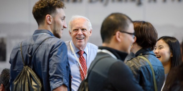 John Hennessy chats with finalists on the Friday they gathered on campus in January to begin a weekend of events. (LINDA CICERO/Stanford News)