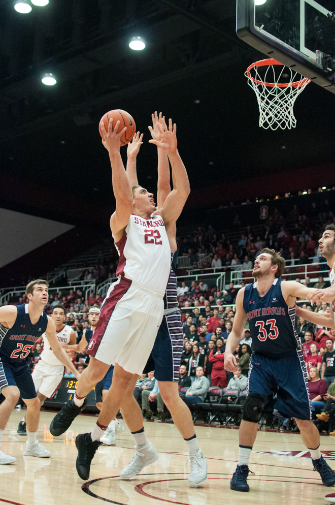 Senior forward Reid Travis (above) ended with a double-double (16 points and 10 rebounds) in the disappointing loss to Utah on Thursday night.(RAHIM ULLAH/The Stanford Daily)