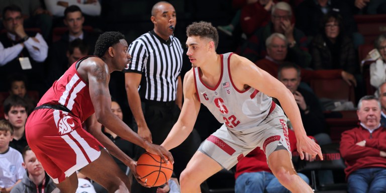 Senior forward Reid Travis (right) dominated Arizona in their previous matchup, scoring 14 first-half points.(BOB DREBIN/isiphotos.com)