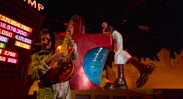 (Left to right) Pete Townshend of The Who and Elton John is the Pinball Wizard in Ken Russell's "Tommy" (1975). (Courtesy of Columbia Pictures)