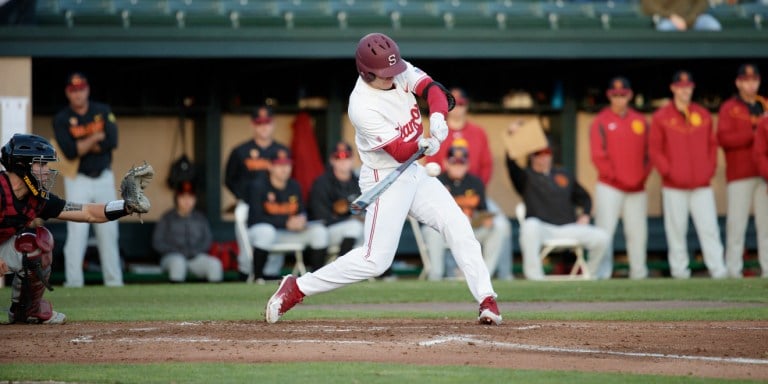 Freshman center fielder Tim Tawa (above) smashed a two-run homer in the fifth inning to tie the game 3-3. His defense proved invaluable to the Cardinal win when he made a diving catch in the 8th.