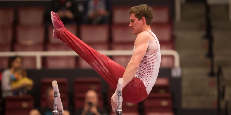 Senior gymnast Robert Neff (above) is ranked second in the nation on high bar, and earned a score of 14.250 at the MPSF Championships that awarded him second place. (CASEY VALENTINE/isiphotos.com)