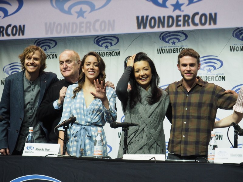 (Left to right) Jed Whedon, Jeph Loeb, Chloe Bennet, Ming-Na Wen and Iain de Caestecker of Marvel's "Agents of S.H.I.E.L.D." pose for photos after the show's panel at WonderCon Anaheim 2018. (OLIVIA POPP/The Stanford Daily)