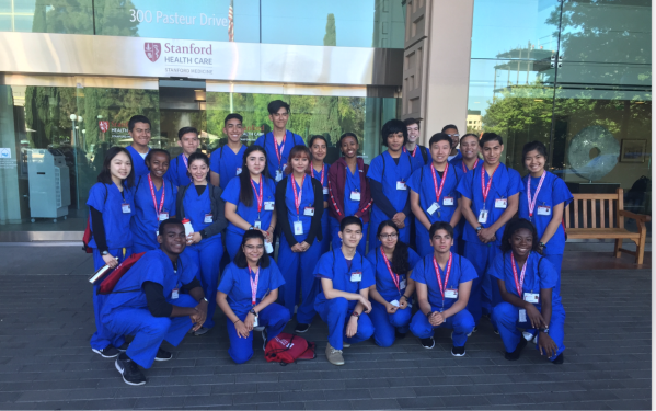 The SMYSP participants pose for a group photo outside the Stanford Health Care hospital, where they participate in an internship. (Courtesy of Allan Ndovu)