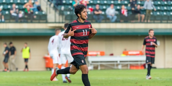 Senior midfielder Amir Bashti celebrates during a game earlier this season. Bashti set the tone early for the Cardinal with a goal in the second minute to lead them to a 3-1 win over Washington on Sunday.