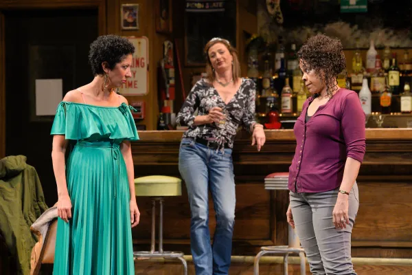 Jessie (Sarah Nina  Hayon) and Cynthia (Tonye Patano) 
discuss the rumors that their positions could be  outsourced to Mexico in Lynn Nottage’s 2017 Pulitzer Prize–winning  drama, Sweat, performing  at A.C.T.’s Geary Theater now through Sunday, October 21, 2018. Background: Tracey (Lise Bruneau) (Courtesy of Kevin Berne)