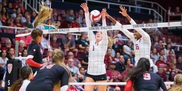 Senior middle blocker Tami Alade goes up for a block during the Cardinal's match against Utah on Nov. 4. Alade had a career-high 15 blocks in the match, which was the second most ever by a Stanford player.