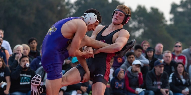 Redshirt sophomore Requir Van Der Merwe wrestles during an outdoor meet earlier this season. Van Der Merwe had another dominant match to help the Cardinal win both their meets on Saturday.