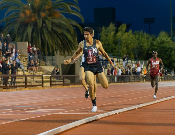 Senior Grant Fisher (above) won the 5,000 meters on Friday in a lifetime best 13:29.52. (JOHN P. LOZANO/isiphotos.com)