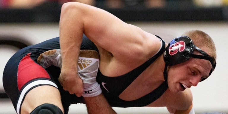 Fifth-year Rico Stormer (above) pins down his opponent. Though the Cardinal crushed Cal Baptist, Stormer lost one of his first of the season against CSU Bakersfield. (JOHN LOZANO/isiphotos.com)