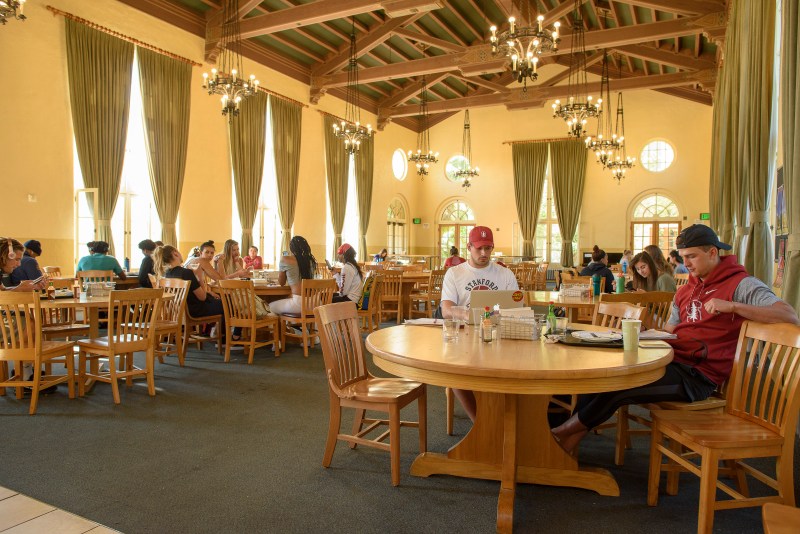 Students linger over breakfast and work on projects in Branner Dining Hall.