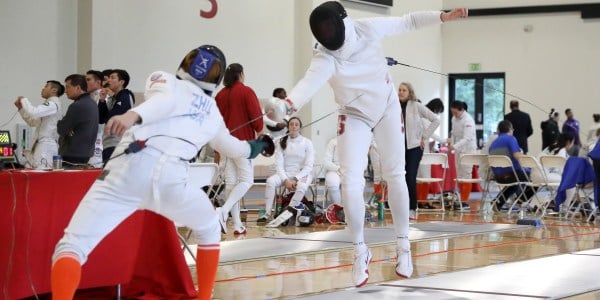 Senior Sean Strong (above right) placed sixth in epee as the Cardinal scored 51 points to finish 12th at the NCAA Championships. (BOB DREBIN/isiphotos.com)