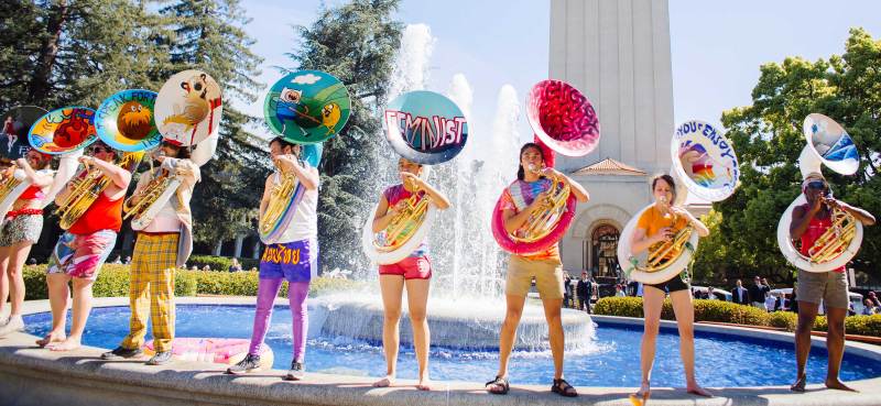 A marching band plays on Hoover Fountain.