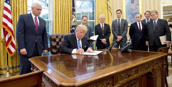 President Donald Trump signs executive orders, including one to reinstate the Mexico City Policy, on January 23, 2017. (Photo: U.S. Government)