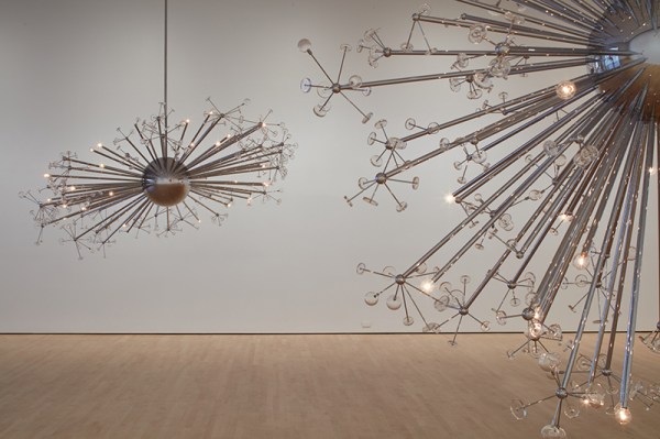 Five chandelier-like models hang in Josiah McElheny’s "Island Universe" exhibition, which combines art and science to explain five potential ways that the universe is expanding. (BRIAN LEE/The Stanford Daily)