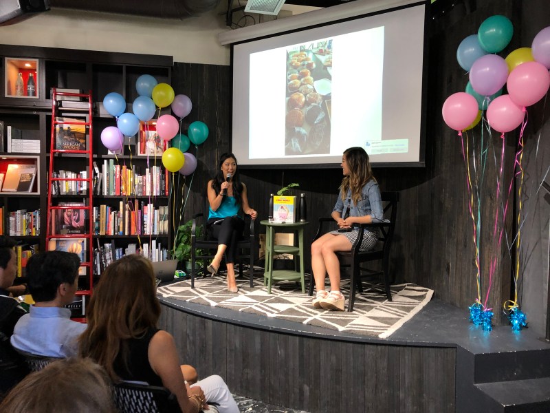 Rachel Fong '21 (right)  celebrated her cookbook’s official release on Sunday with a special baking party at Kepler’s Books in Menlo Park. (Photo courtesy of Rachel Fong)