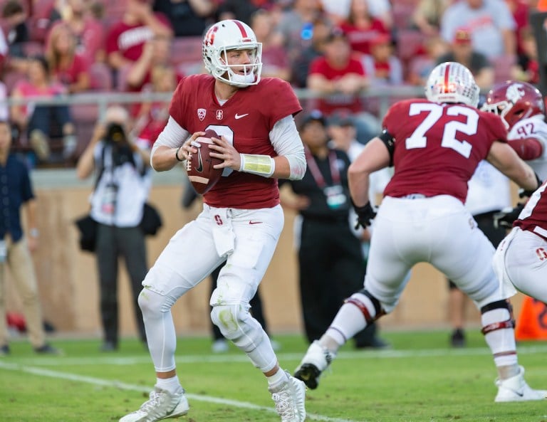 Senior quarterback K.J. Costello (above) threw 157 yards and one touchdown before being escorted off the field with an injury in second quarter of Saturday's season opener. Despite losing the veteran for the remainder of the game, the No. 25 Cardinal prevailed 17-7 against Northwestern. (JOHN P. LOZANO/isiphotos.com)