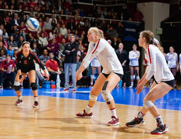 Morgan Hentz (left), Kathryn Plummer (center) and Meghan McClure (right) represent three of the five All-Americans that the Cardinal are returning from their 2018 campaign. After claiming the program's eighth national title, the team looks to capture an undefeated season that will end with championship No. 9. (JOHN P. LOZANO/isiphotos.com)