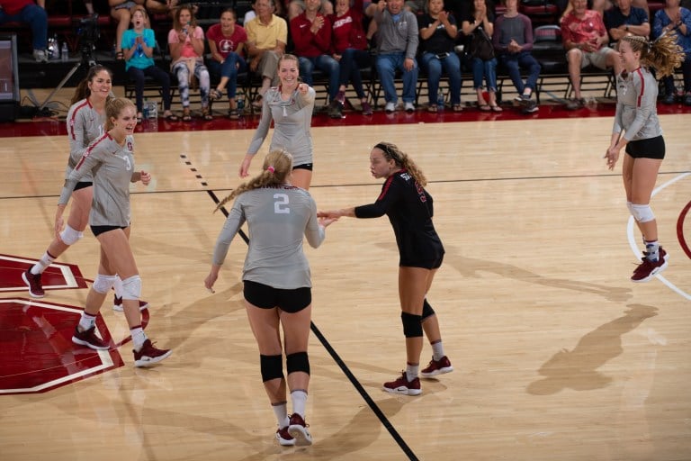 It required a true team effort to overcome the top-ranked Huskers on Wednesday night. Eight different players recorded points, and nine tallied at least one block or dig. (MIKE RASAY/isiphotos.com)