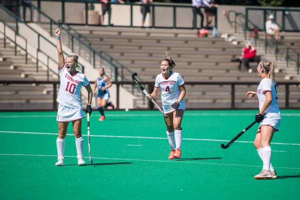 Junior attacker Corinne Zanolli, freshman midfielder Megan Frost and sophomore midfielder Fenella Scutt (from left to right) celebrate during a 4-1 win over unranked Quinnipiac on Sept. 3. Friday's victory over No. 7 Michigan makes it two-straight wins for the Cardinal. (Photo: Karen Ambrose Hickey/isiphotos.com)