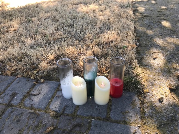 Candles are set up outside the house of Santino Legan’s family in Gilroy, just minutes from the festival grounds where he shot and killed four people, including himself, on July 28. (Photo: ERIN WOO/The Stanford Daily)