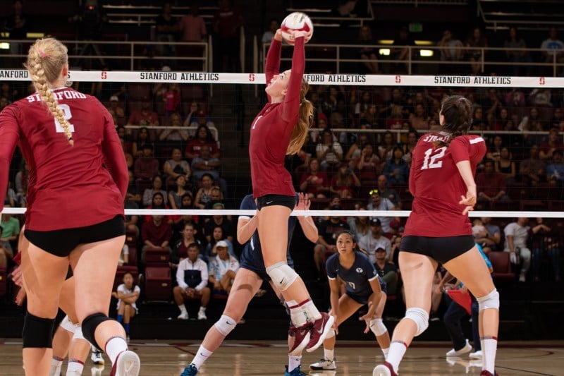 Jenna Gray (center) continues to prove that she is one of the best setters to come through the Farm. Following her 48-assist performance over Cal, she now has the fourth-most career assists (4,500) in school history. (MIKE RASAY/isiphotos.com)