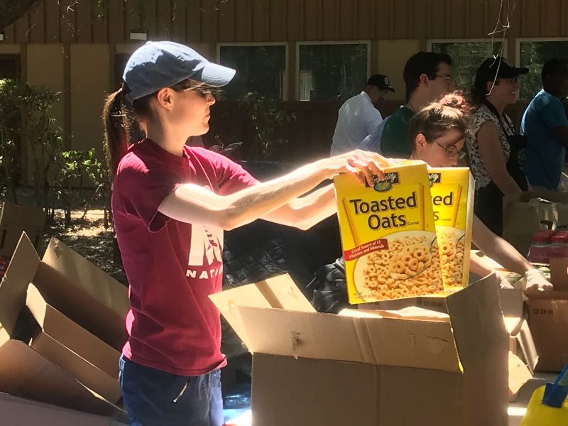 More than four dozen volunteers from the Stanford community, including undergrads, grad students and Residential & Dining Enterprises staff helped unload and unpack crates and boxes. (Photo: HOLDEN FOREMAN/The Stanford Daily)
