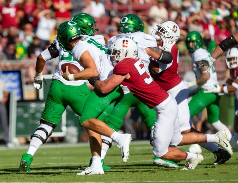 Casey Toohill sacks fellow William V. Campbell Trophy nominee, Oregon quarterback Justin Herbert earlier this season. In addition to shining in the classroom and in leadership endeavors, Toohill has 45 total tackles, including 7.5 tackles for loss and five sacks, on the season. (JOHN P. LOZANO/isiphotos.com)