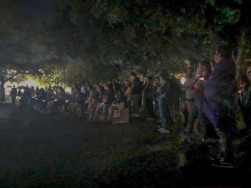 Members of the Native American community and their allies take part in the Indigenous Peoples' Day vigil at White Plaza, watching student performances and hearing their stories. (Photo: Patricia Wei/The Stanford Daily)