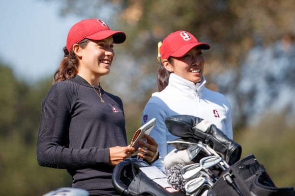 Senior Alabane Valenzuela (left) and Director of Operations for Men's and Women's Golf Lauren Dobashi (right) discuss strategy for the upcoming match. Valenzuela looks to continue her dominance this year at The Big Match following her latest third-place individual finish at The Molly College Invitational. (BOB DREBIN/isiphotos.com)