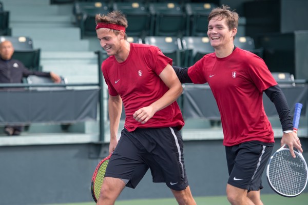 Junior Axel Geller (left) and sophomore Alexandre Rotsaert (right) are Stanford men's tennis' top returning players this season. The duo were exceptional individually in singles play and in doubles play; they ended the year ranked 21st in the nation in doubles. (LYNDSAY RADNEDGE/isiphotos.com)