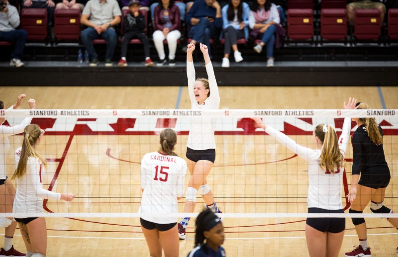 Junior Meghan McClure (center) helped lead the Cardinal to a five set victory over No. 18 Utah with 14 kills and just a single error. McClure also recorded ten digs for her first double-double of the season. (PHOTO: ERIN CHANG/isiphotos.com)