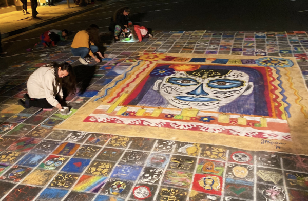 During the Redwood City celebration of Día de los Muertos 2019, passerbys could add their own contributions to the community mural.
(Photo: MARIA METZGER/The Stanford Daily)