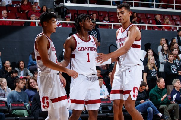 With the absence of freshman guard Ty Terry (left), Stanford relied on junior guard Daejon Davis (center) and junior forward Oscar da Silva (right) to lead the Cardinal to victory in Tuesday's meeting with USF. (Photo: BOB DREBIN / isiphoto.com)