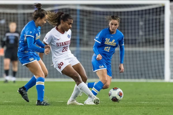 Junior midfielder Catarina Macario (above) beat out UCLA's Jessie Fleming (right, 21) and UNC's Emily Fox for the Hermann Trophy. (Photo: JIM SHORIN/isiphotos.com)