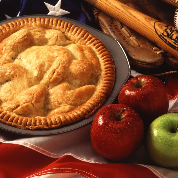 A freshly baked apple pie sits atop the U.S. flag. (Photo: courtesy of Wikimedia Commons)