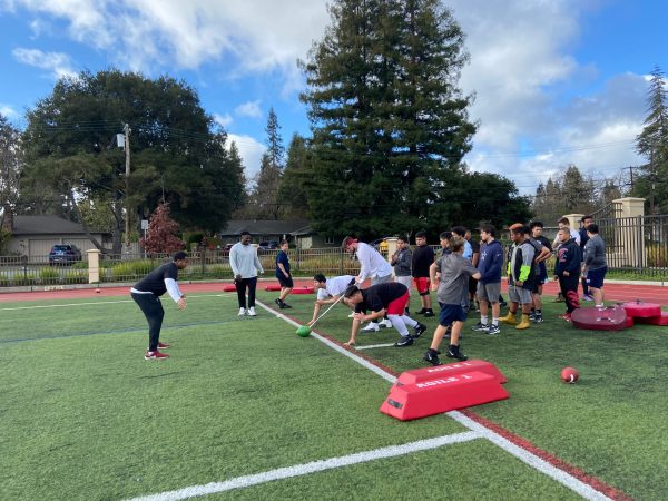 Defensive ends senior Jován Swann (above, left), senior Mike Williams (above, middle) and junior Dylan Boles (above, right) ran defensive trills in last month's football camp. All athletes were paid for their time. (PHOTO: Daniel Martinez-Krams/The Stanford Daily)