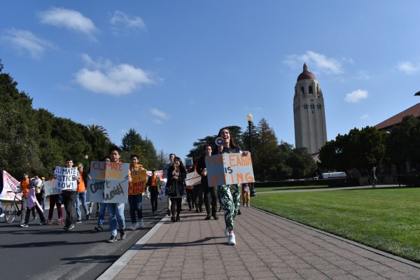 Fossil Free Stanford students march down Jane Stanford Way