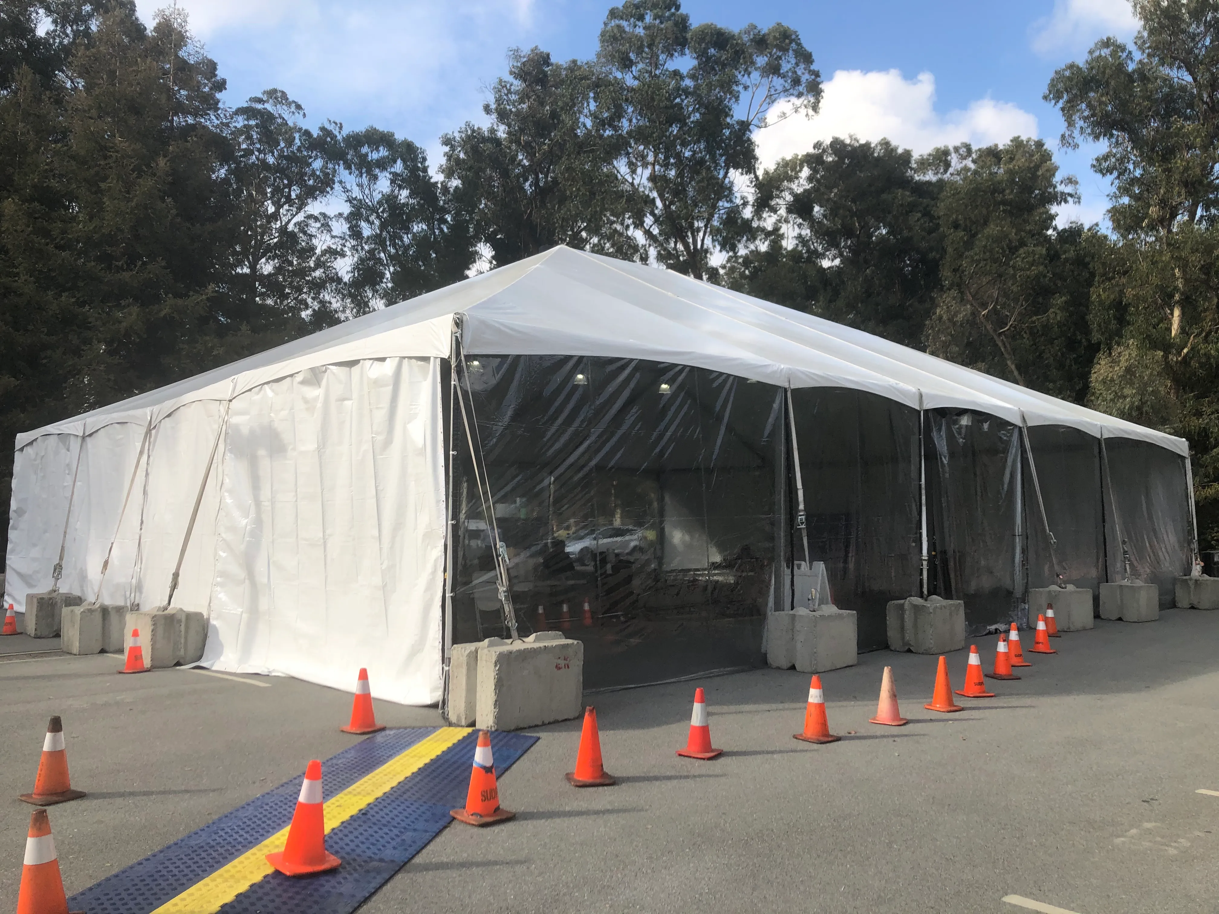 A tent being used for drive-thru testing at the Galvez parking lot