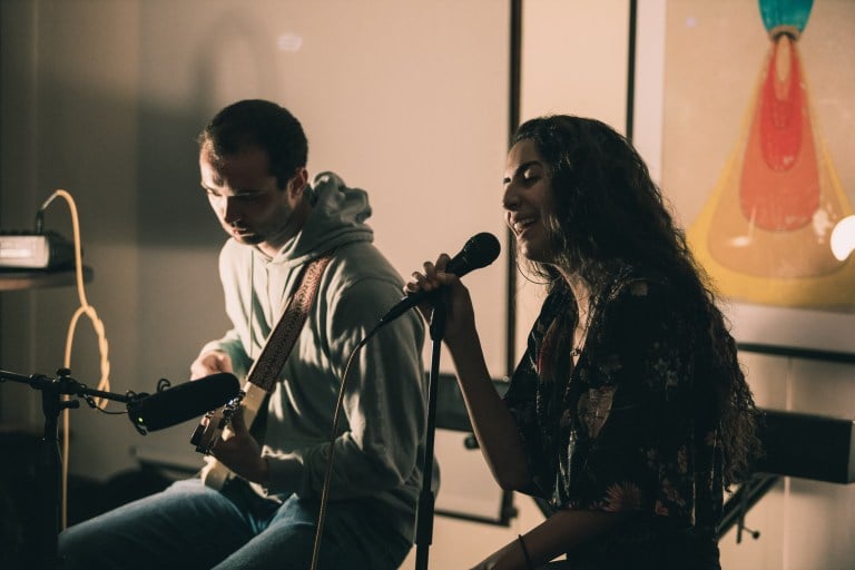 Miriam El-Mansouri '22 surprises the audience with her cover of French classic "Rein de Rein" accompanied by William Kingsfield '20 on the guitar at Wednesday's Music @ Mars event, the second of the school year. (Photo courtesy of Paulo Makalinao)