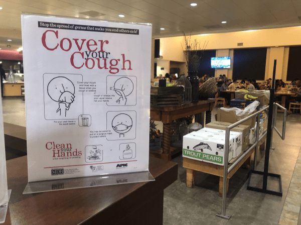 A sign in Arrillaga urges, "Cover your Cough." (Photo: WON GI JUNG/The Stanford Daily)
