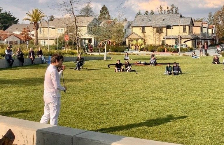 Stanford-affiliated concert violinist Francisco Fullana performs for enthusiastic, socially-distanced neighbors in local park. (Photo credit: Alice Ting)