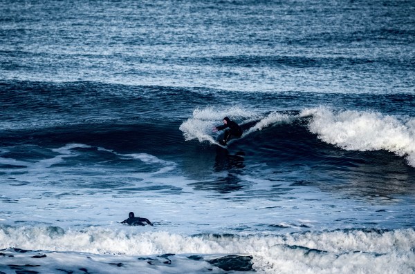 Roberto Lama (above) surfing at Pacheco St., Ocean Beach in San Francisco. He frequently surfs before classes, while on campus, but most California beaches are now closed due to COVID-19. (Photo: Críscia Cesconetto)