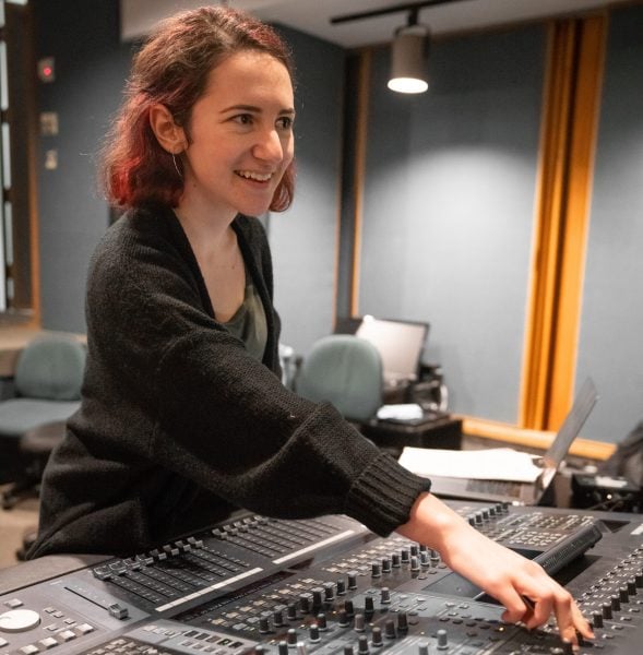 Stanford recording engineer Elena Georgieva M.A. '19 operates the sound board in the CCRMA recording studio. (Photo courtesy of Elena Georgieva)
