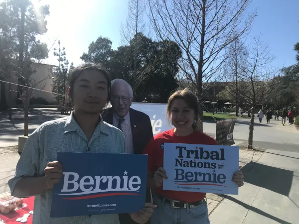 Ryan Yu and Alyssa LaTray hold signs for Sanders. (Photo courtesy of Ryan Yu)