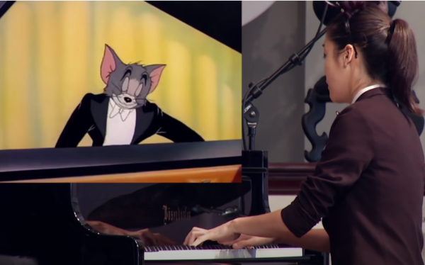 Yannie Tan '23 plays Hungarian Rhapsody No.2 by Franz Liszt in her 2017 viral "Cat Concerto"  video featuring her piano performance and Tom and Jerry (Photo: Youtube)