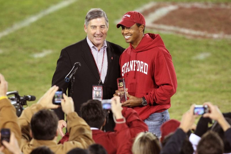 On May 3, 2012, Bob Bowlsby (above, left) announced his departure from athletic director at Stanford to assume the role of Big 12 Conference commissioner — a position that he still holds. Bowlsby led the Cardinal for four years and his impact is still felt on the football field; he was the one responsible for hiring current head coach David Shaw. Pictured, Bowlsby presents Tiger Woods (above, right) his Hall of Fame award in 2009. (PHOTO: Bob Drebin/isiphotos.com)