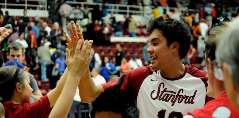 Kawika Shoji '10 high-fives young fans after a win over Pepperdine in 2010. Many young players attend Stanford games with the hope of one day representing the Cardinal themselves. (Photo: DAVID GONZALES/isiphotos.com)