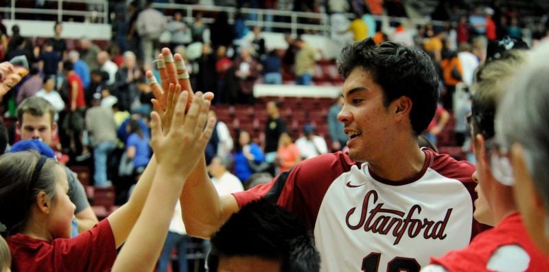 Kawika Shoji '10 high-fives young fans after a win over Pepperdine in 2010. Many young players attend Stanford games with the hope of one day representing the Cardinal themselves. (Photo: DAVID GONZALES/isiphotos.com)